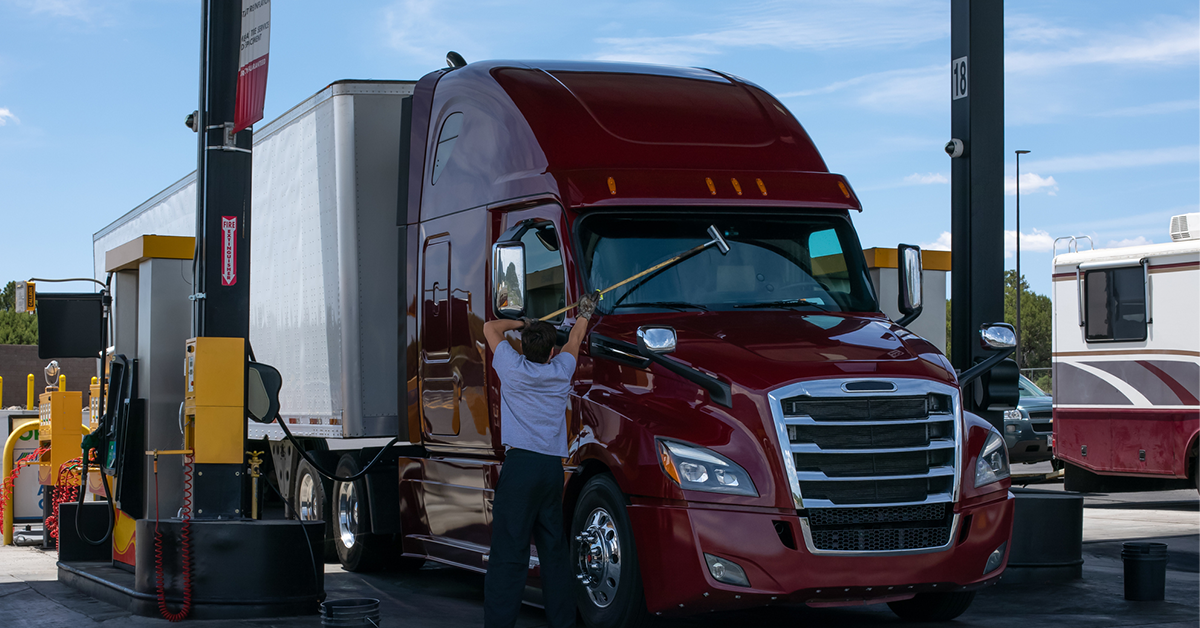 man-washing-truck-at-pump-1200x628